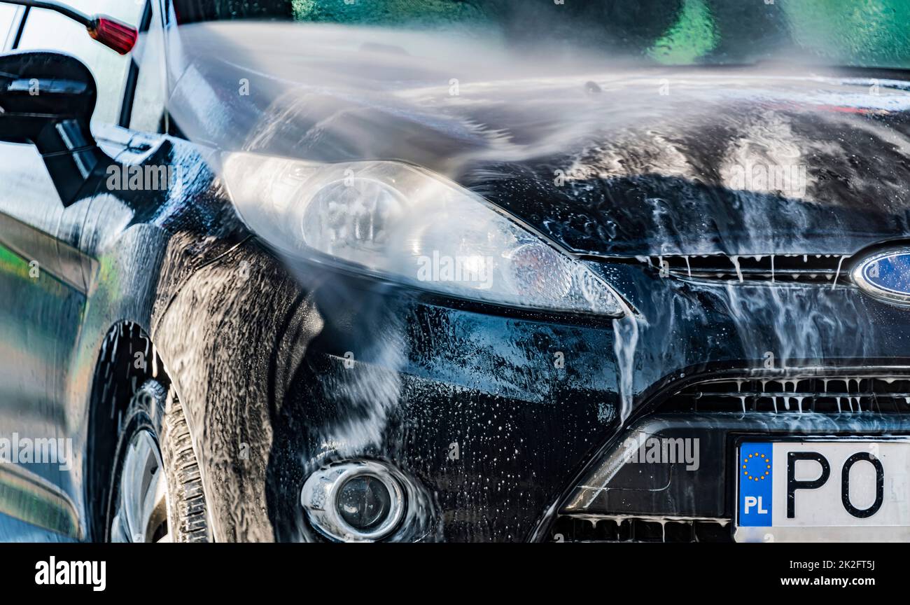 A vehicle in a coinoperated selfservice car wash Stock Photo Alamy