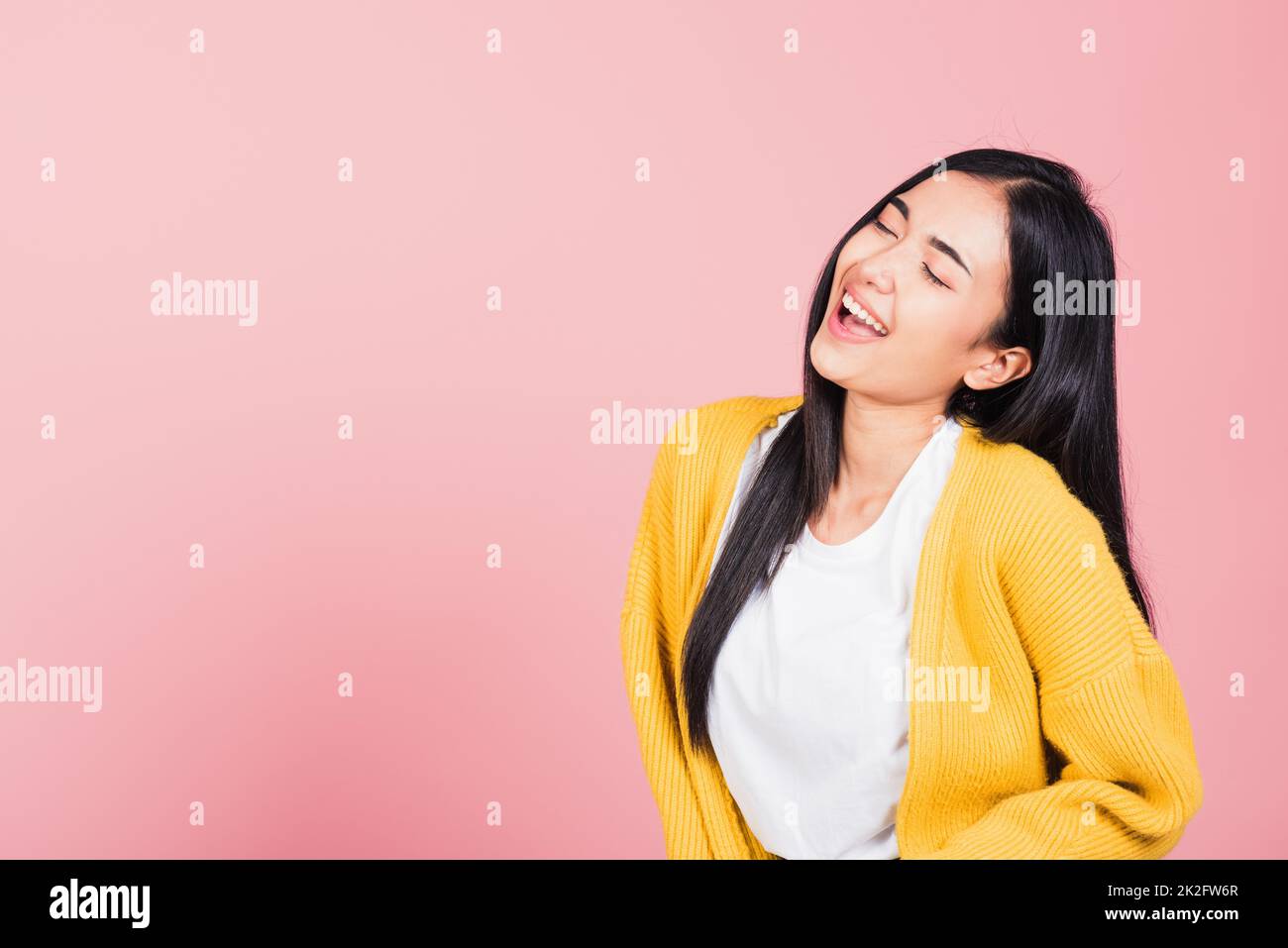 woman standing winning and surprised excited screaming laughing Stock Photo