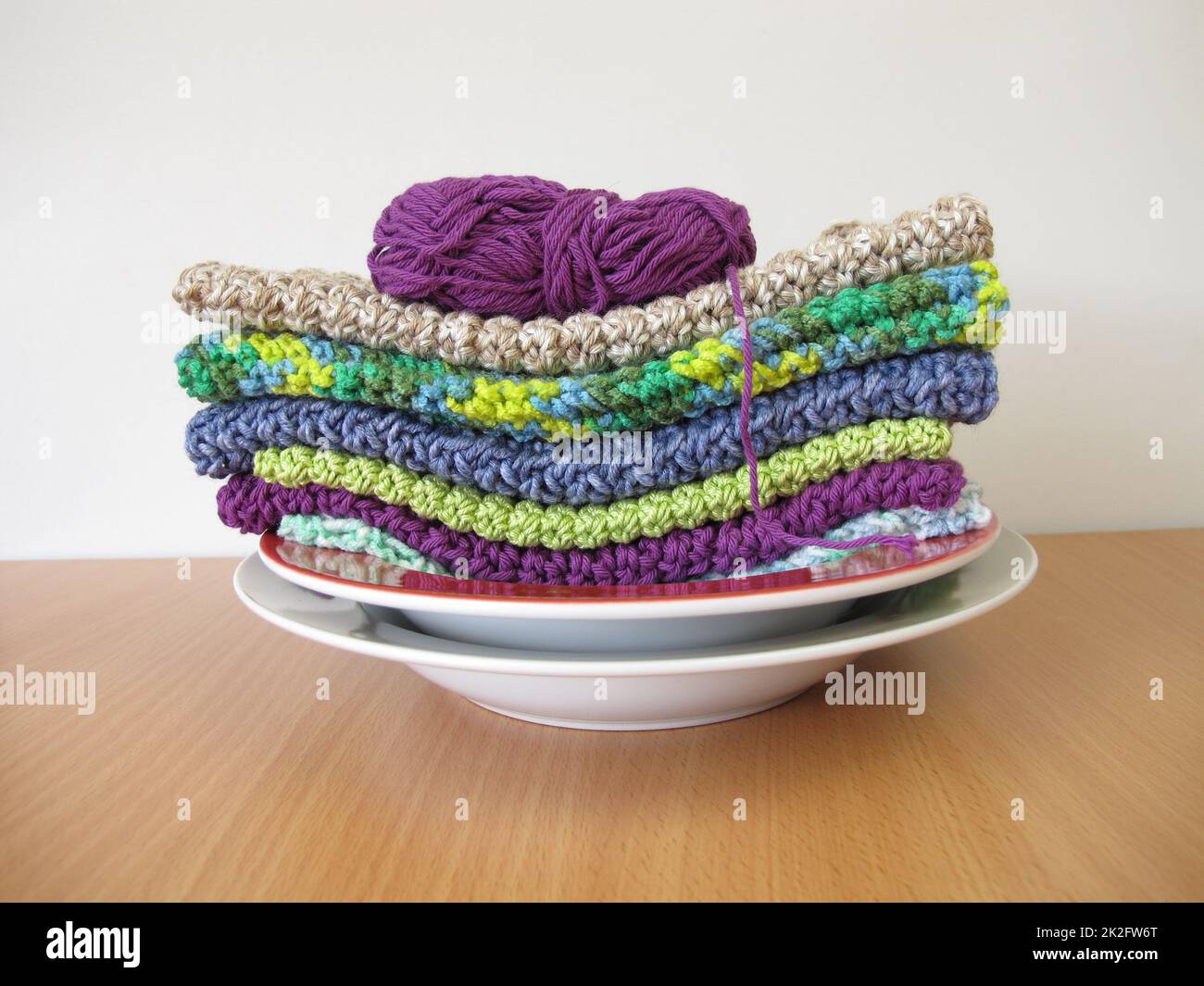 Washable crocheted and knitted dishcloths from wool Stock Photo