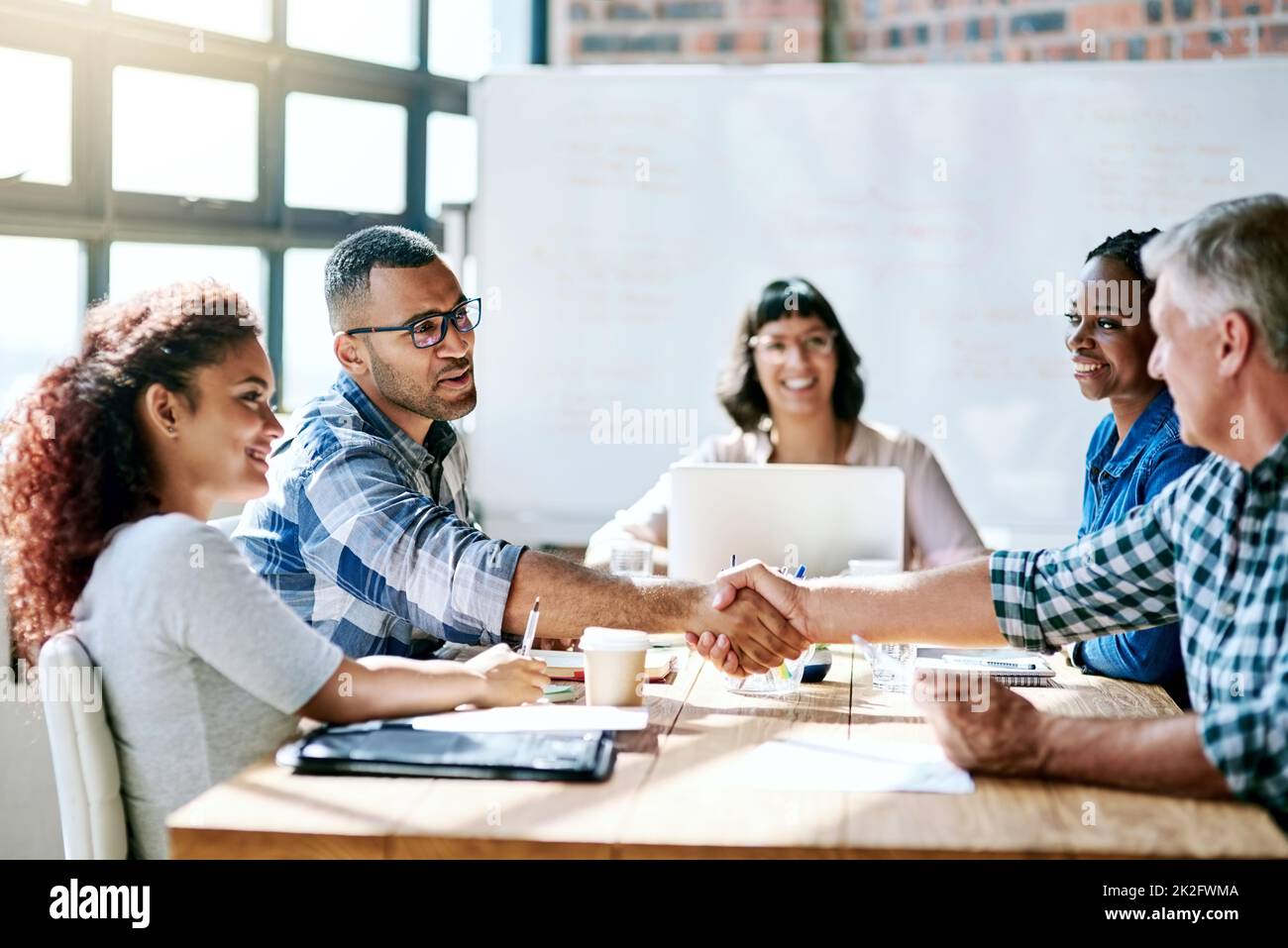 Always be ready for a challenge. Shot of a team of entrepreneurs collaborating in a modern office. Stock Photo