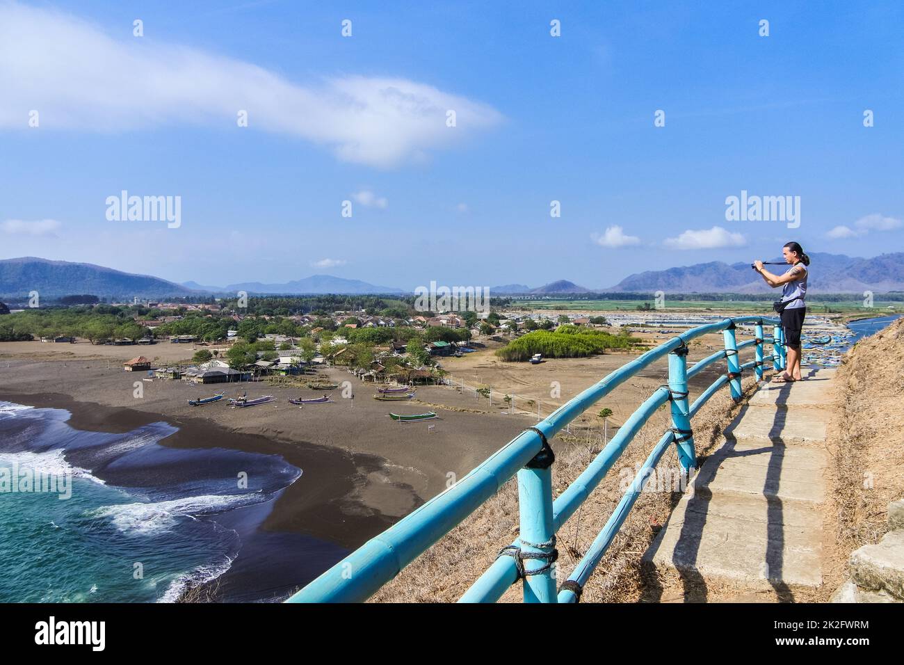Beautiful View Around Teluk Cinta with ocean, trees, coast and blue sky in Jember, East Java, Indonesia. Stock Photo