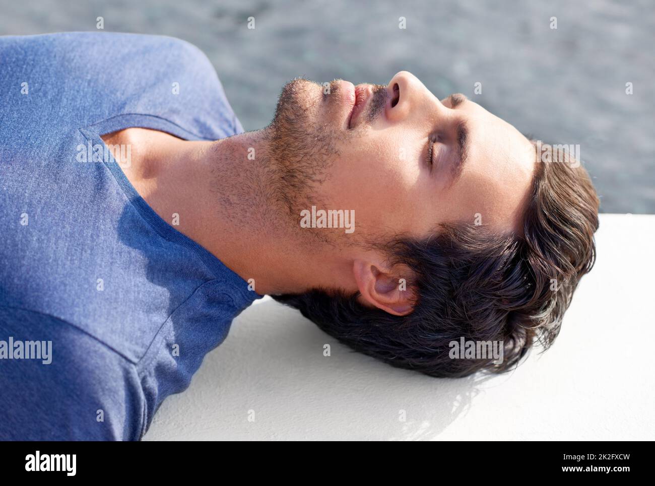 Man lying down eyes closed hi-res stock photography and images - Alamy