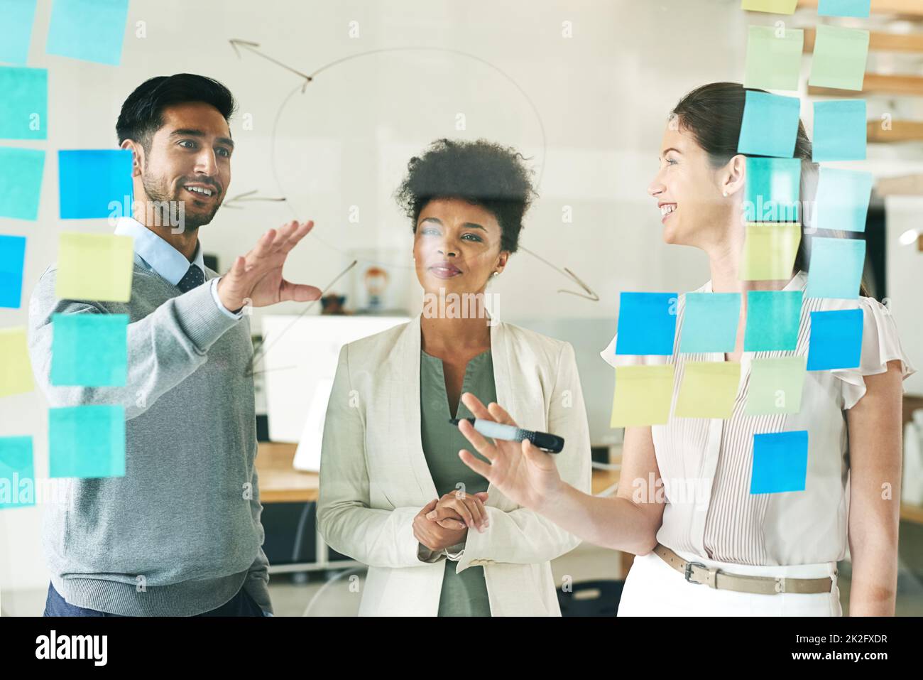 Brainstorming brilliant ideas. Shot of a group of young colleagues having a brainstorming session at work. Stock Photo