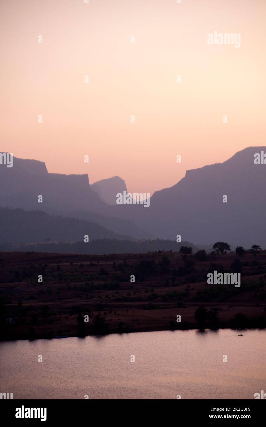 Sunset on Arthur lake at Bhandardara taluka Akole district Ahmednagar state Maharashtra India Stock Photo