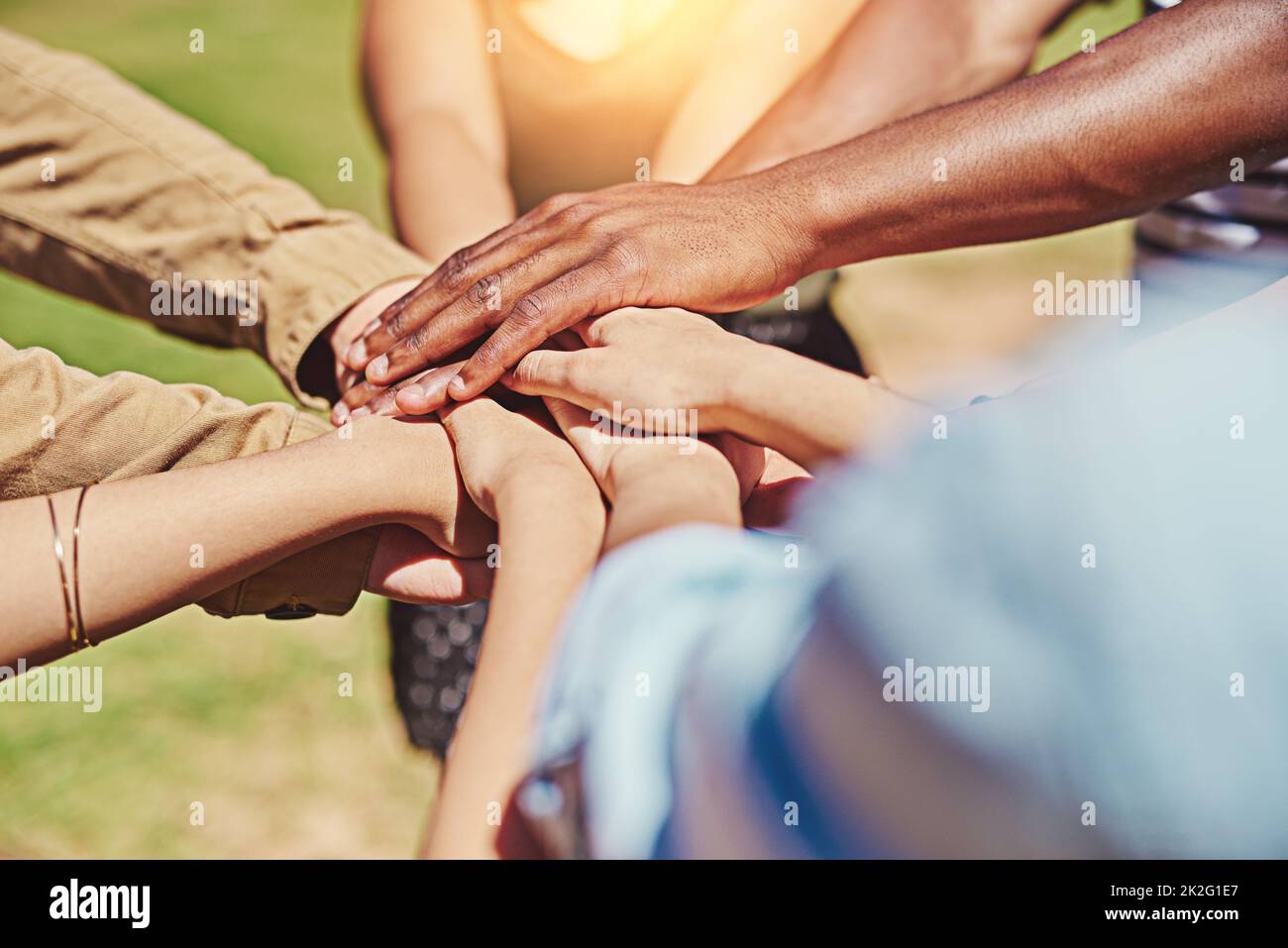 Friendship is a lifelong bond. Cropped shot of a group of friends with their hands piled on top of each other. Stock Photo