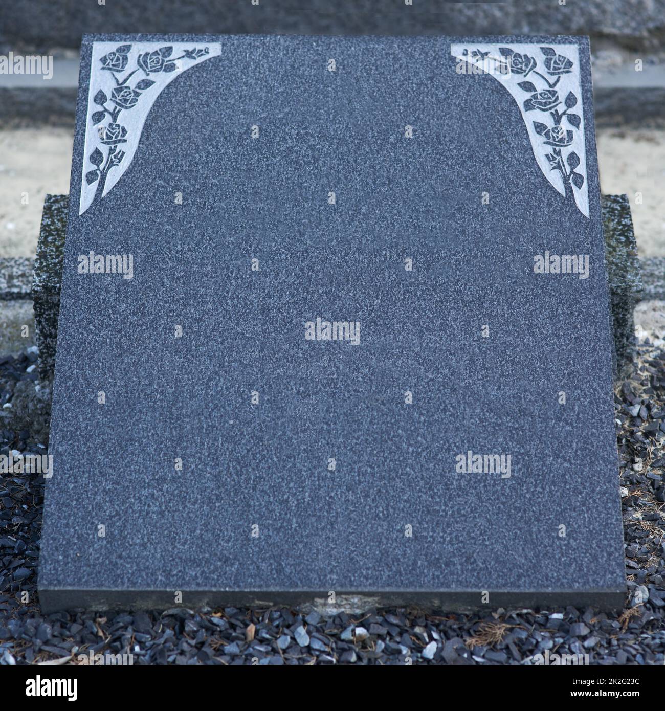 Wonderfully designed to immortalize their memory. Shot of a gravestone in a cemetery. Stock Photo