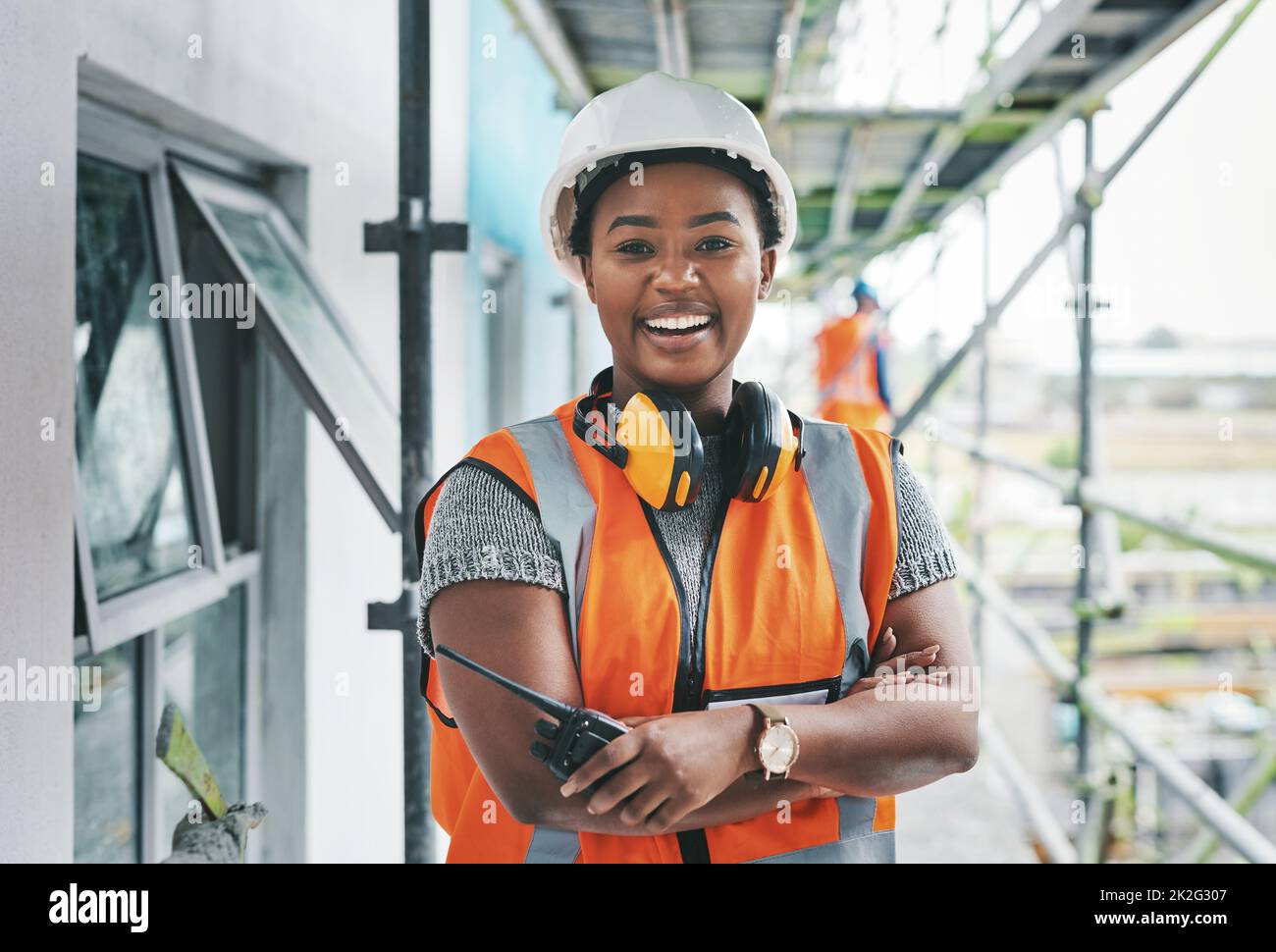 Youll want to invest in this new development. Portrait of a young woman working at a construction site. Stock Photo
