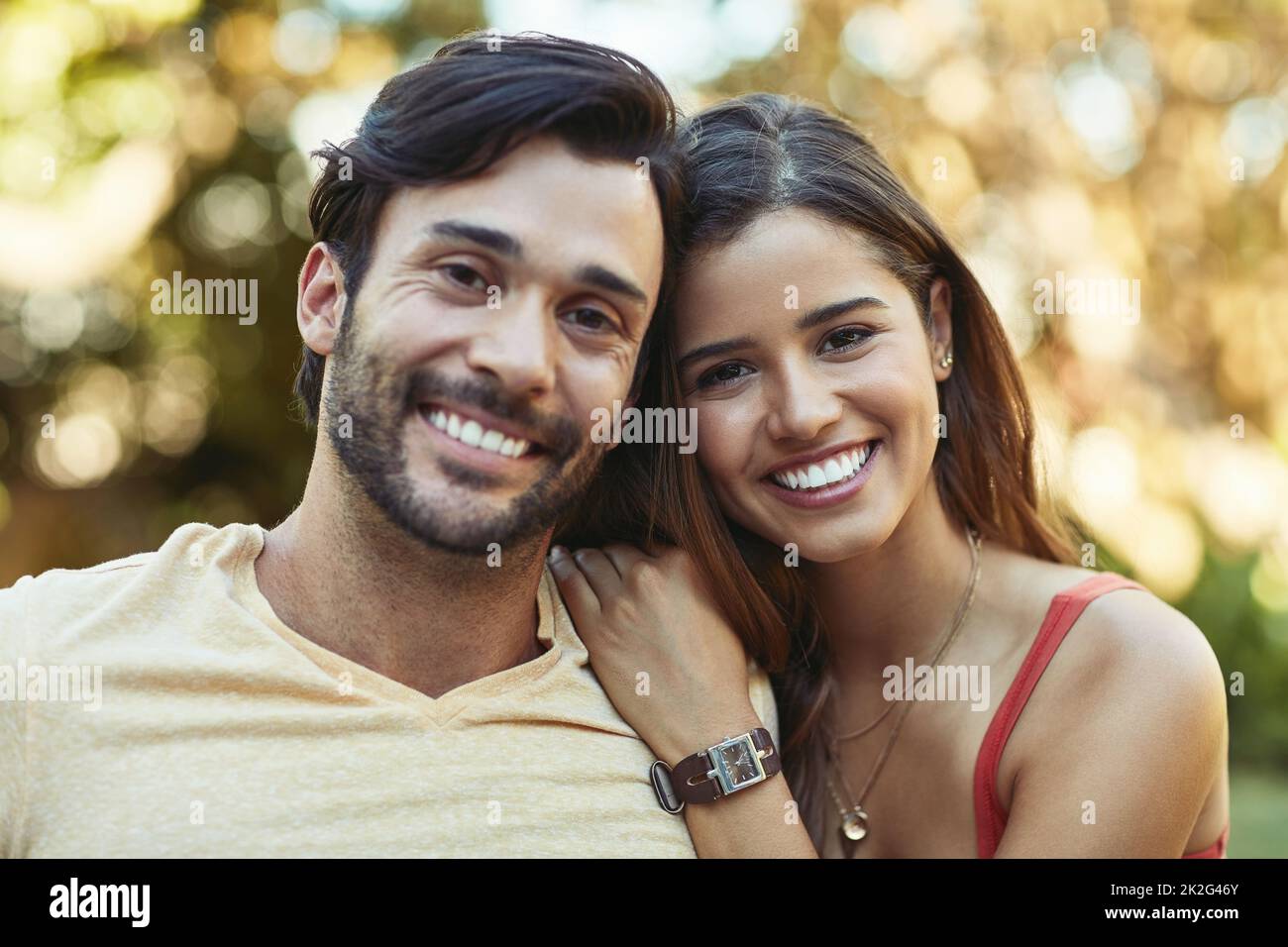 We fall in love again every day. Portrait of a happy young couple posing together outside. Stock Photo