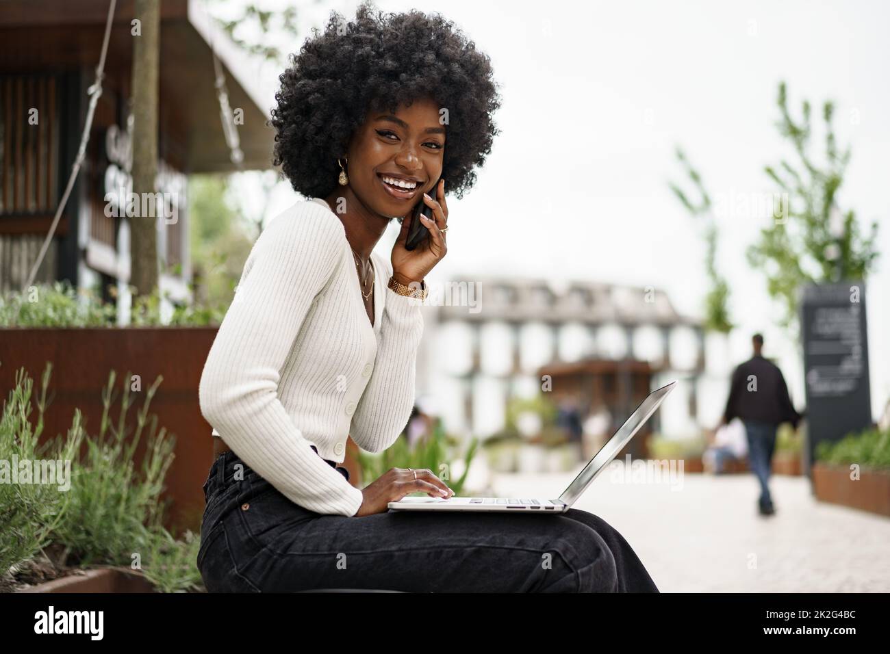 Young african american businesswoman working using laptop sitting on ...