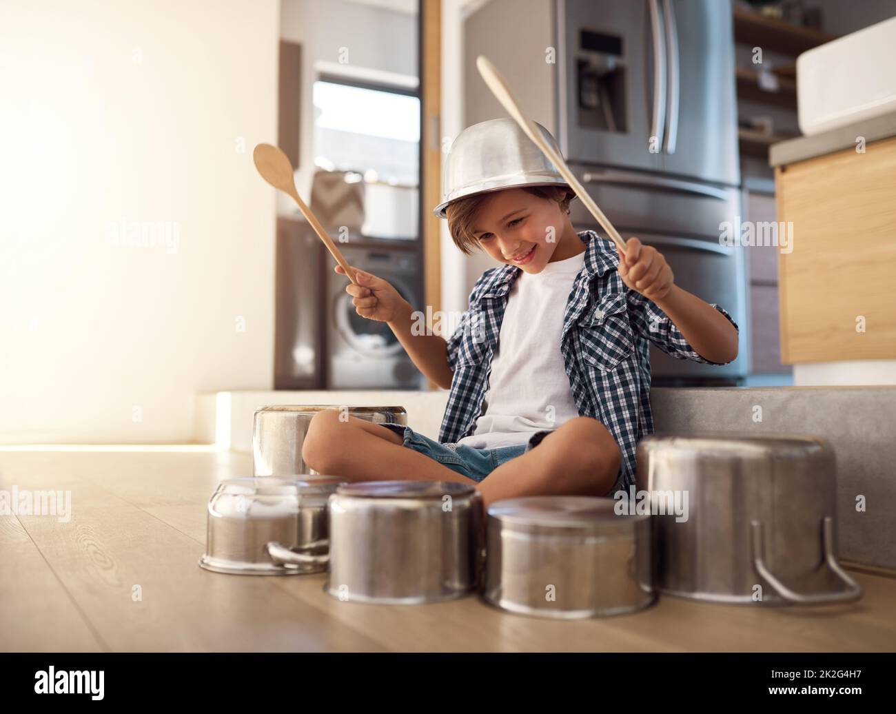 Hes a born percussionist. Shot of a happy little boy playing drums with