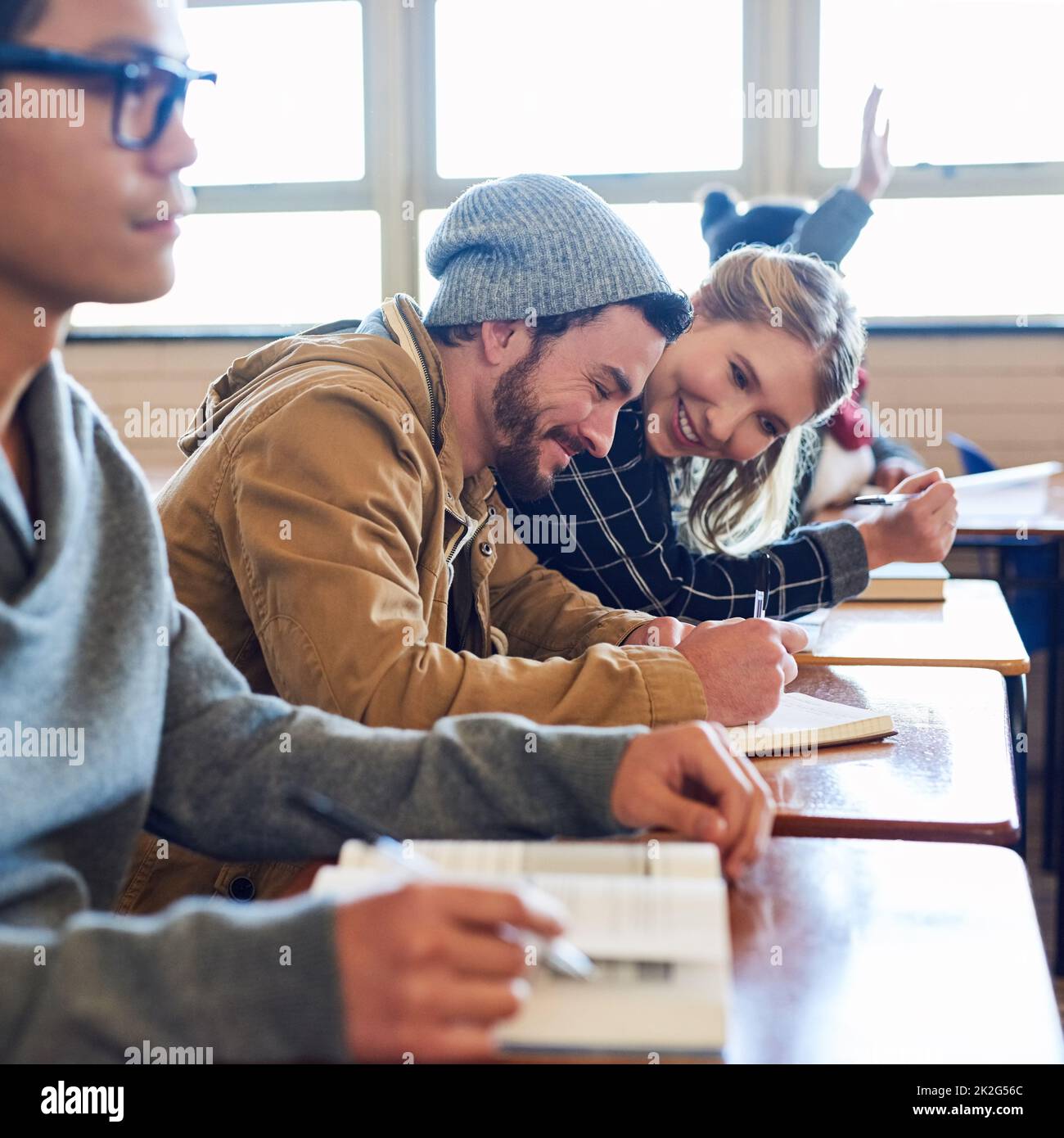 I might need to copy that. Cropped shot of a group of university students working in class while sitting in a lecture. Stock Photo