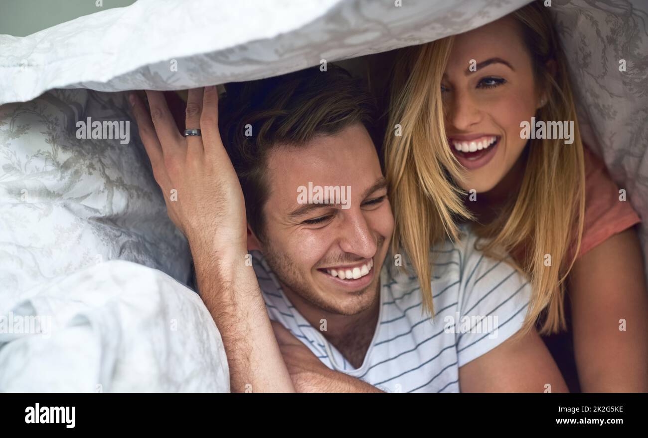 Couple in bed having fun hi-res stock photography and images - Alamy
