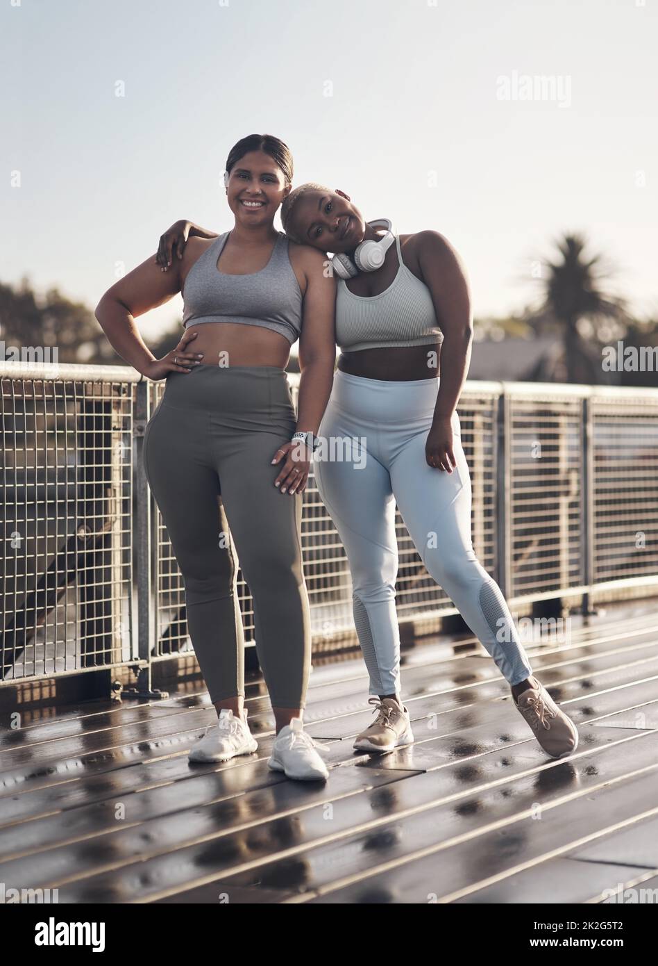 She my best friend and my favourite workout buddy. Shot of two young women out for a run together. Stock Photo
