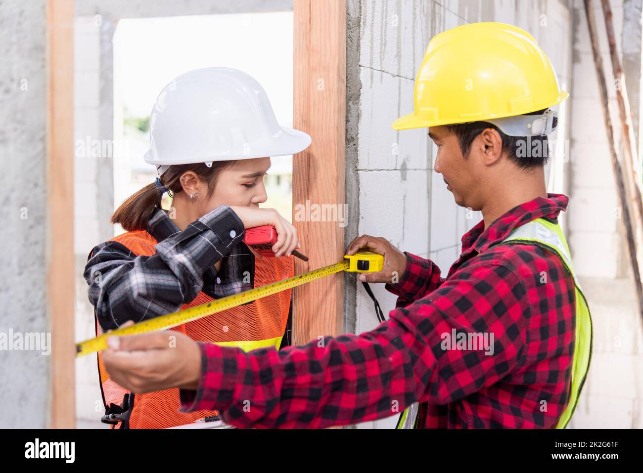 Male industrial builder workers installation process measuring wooden ...