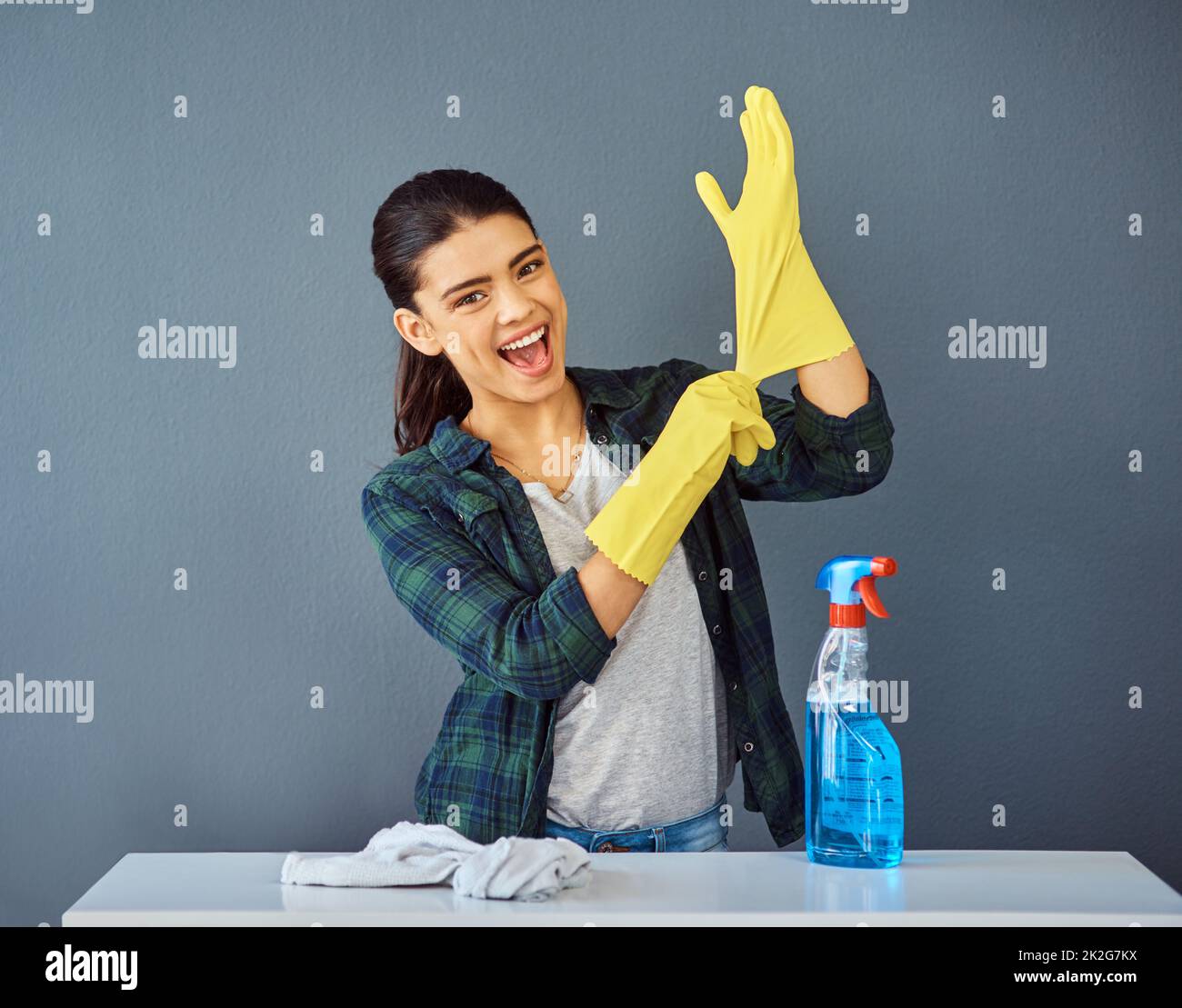 I never clean without my rubber gloves. Studio portrait of an