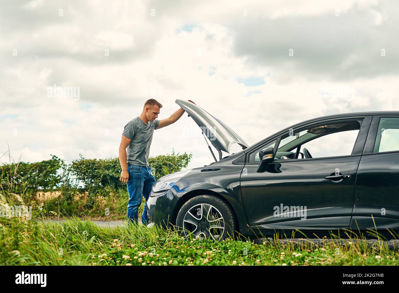 Nobody wants their journey cut short by car problems. Shot of a young