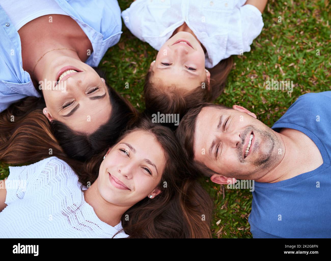 Were just a bunch of peas in a pod. Portrait of a cheerful family lying