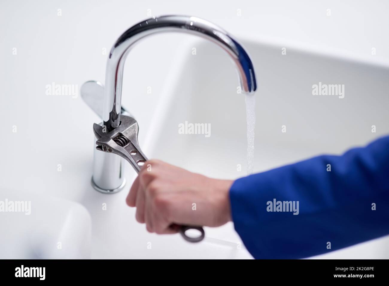 The right tool to fix a faulty faucet. Cropped shot of a plumber