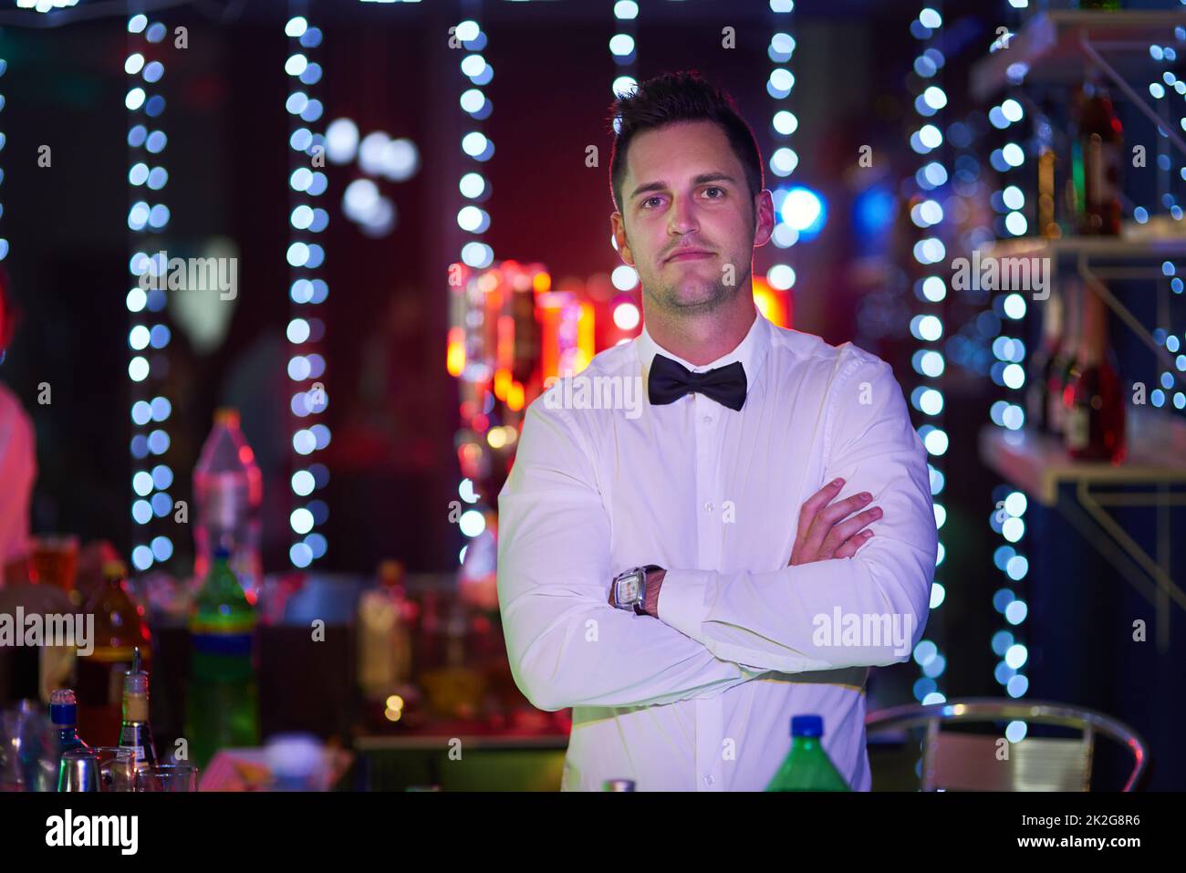 What can i get for you portrait of a serious looking bartender