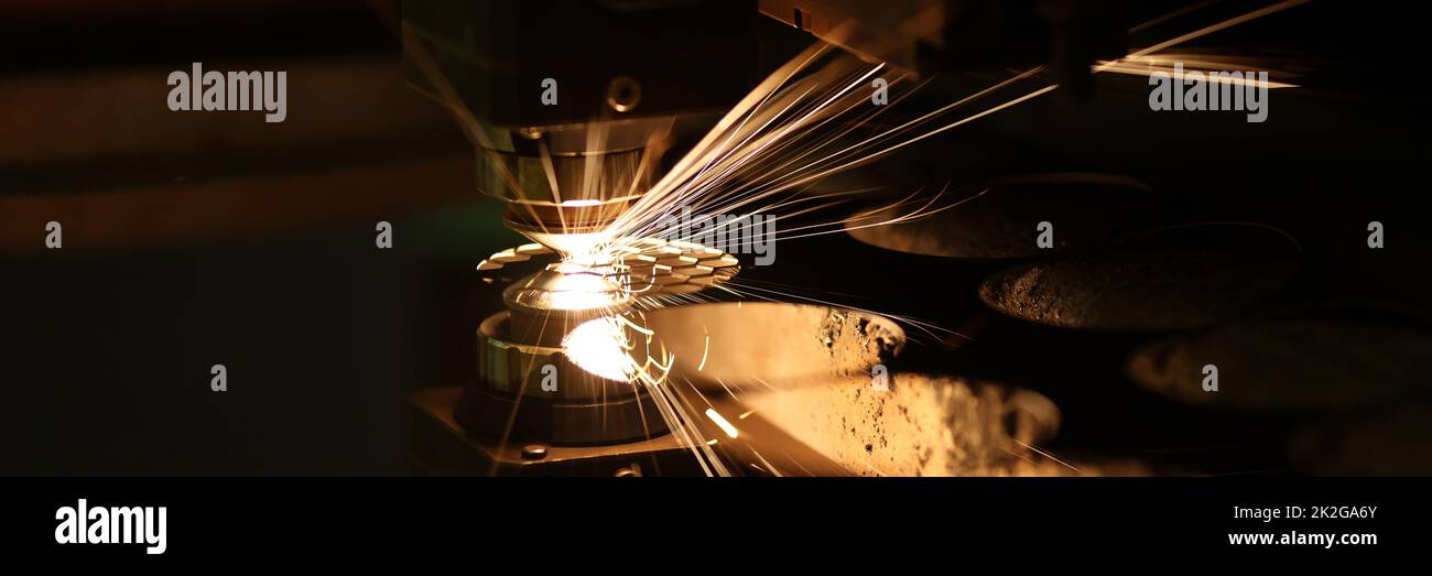 Laser cutting technology flat sheet metal steel material processing with sparks Stock Photo