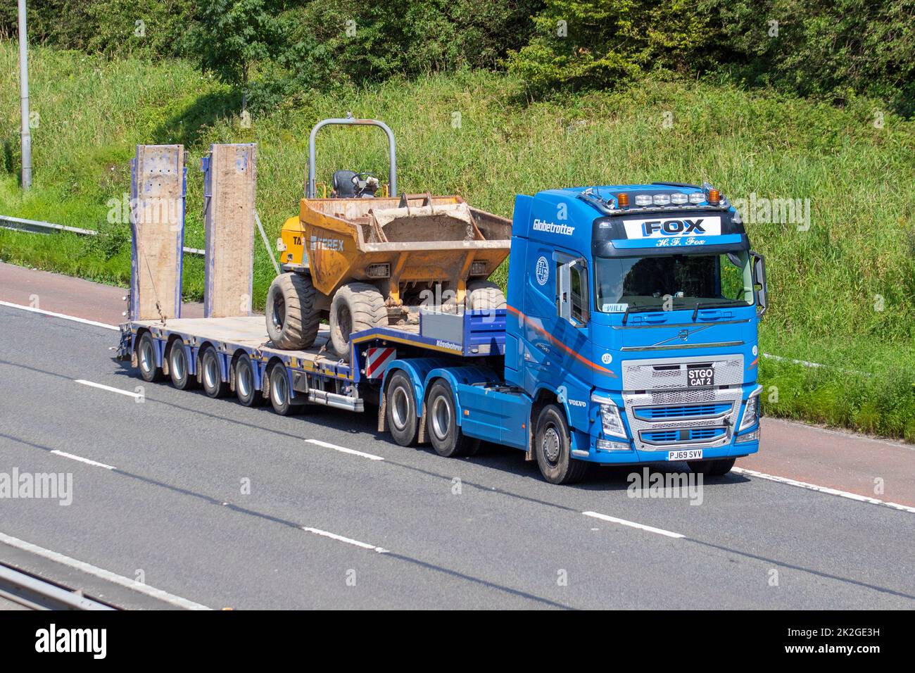 FOX BROTHERS Haulage delivery trucks, lorry, transportation, truck, cargo carrier, Volvo vehicle, European commercial transport, close industry, M61 at Manchester, UK Stock Photo
