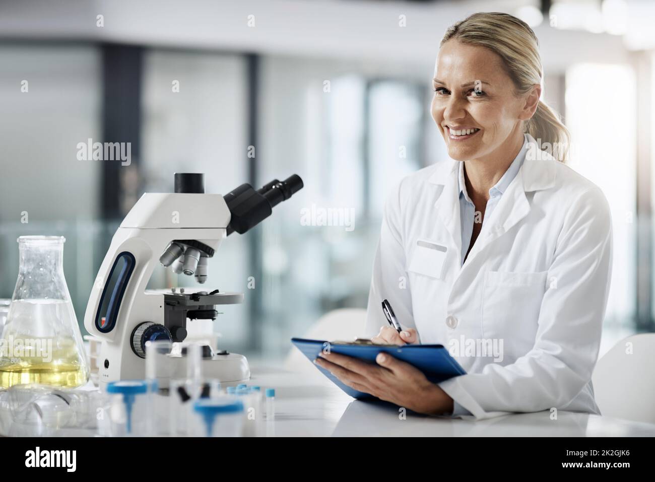 Ive got something. Cropped portrait of an attractive mature female scientist taking down notes while doing research in her lab. Stock Photo