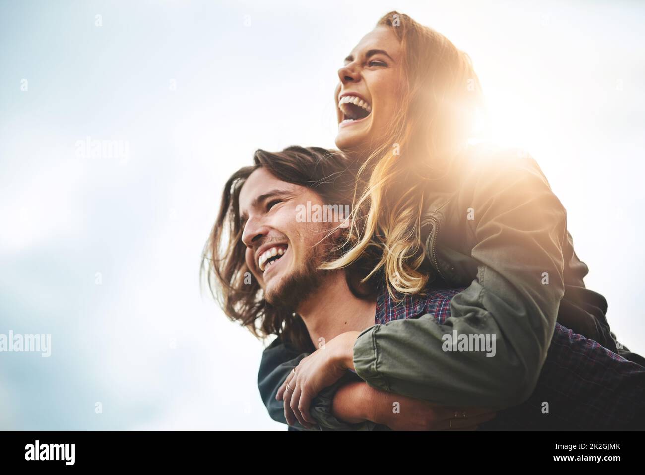 Live, laugh, love. Shot of a happy young couple having fun outside. Stock Photo