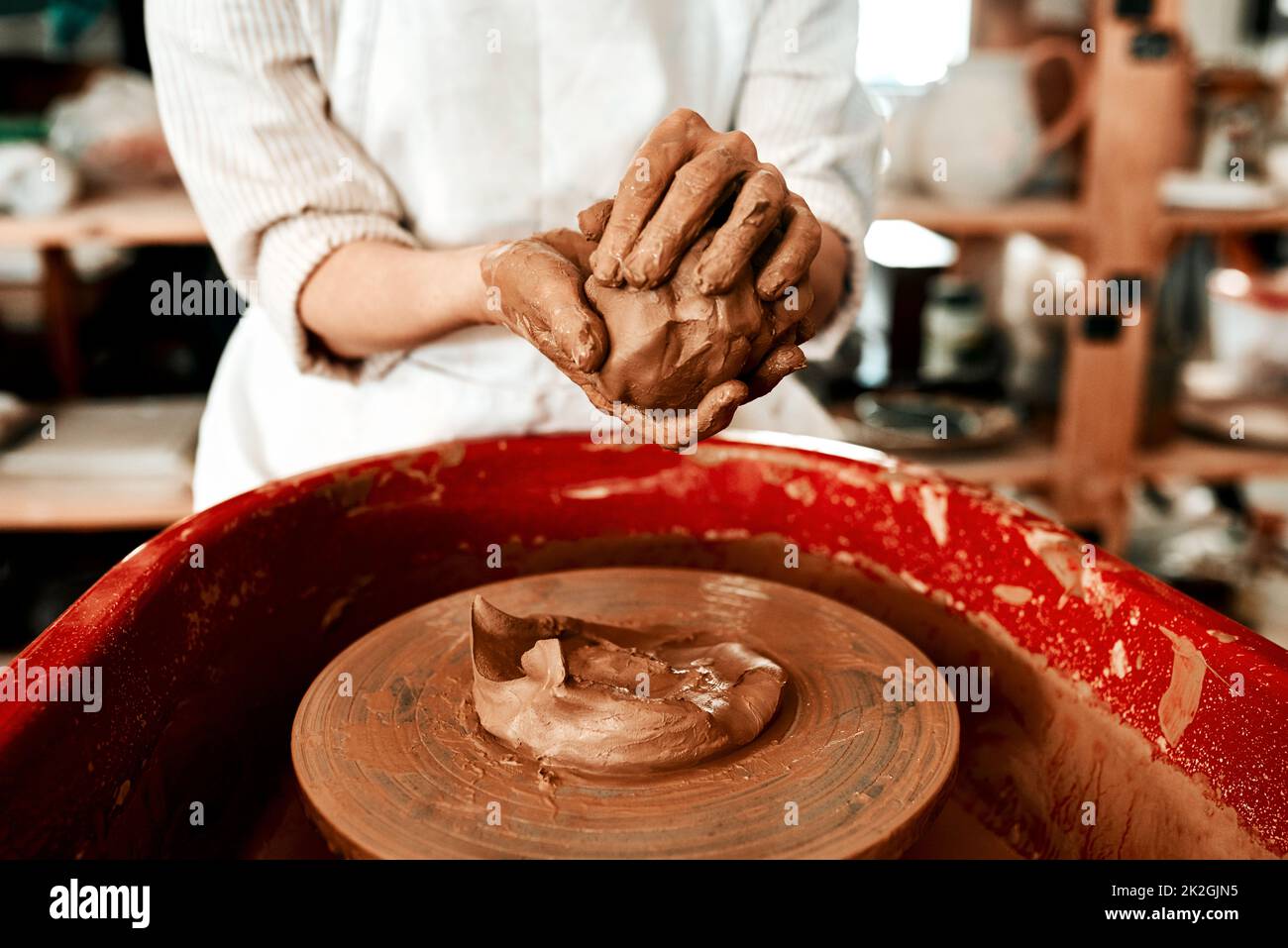 I dont mind getting my hands dirty. an unrecognizable woman molding clay on  a pottery wheel Stock Photo - Alamy