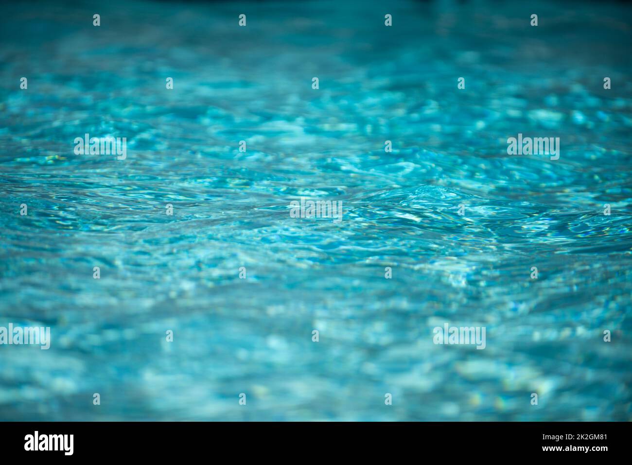 Tansparent clear calm water surface texture. Abstract nature background. Sea water pattern. Stock Photo