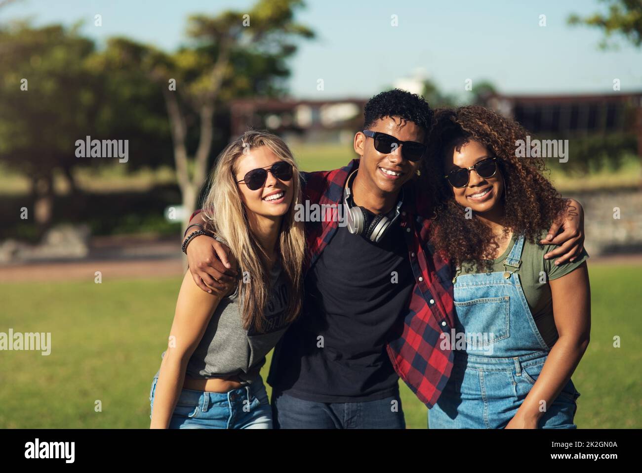 Sunglasses on. Portrait of a group of cheerful young friends posing for