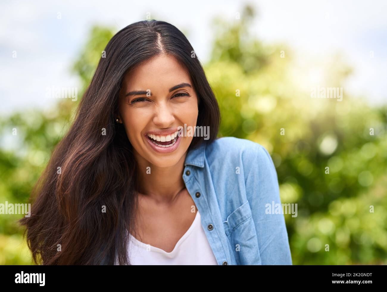 I love being outside. Cropped portrait of an attractive young woman standing outdoors. Stock Photo