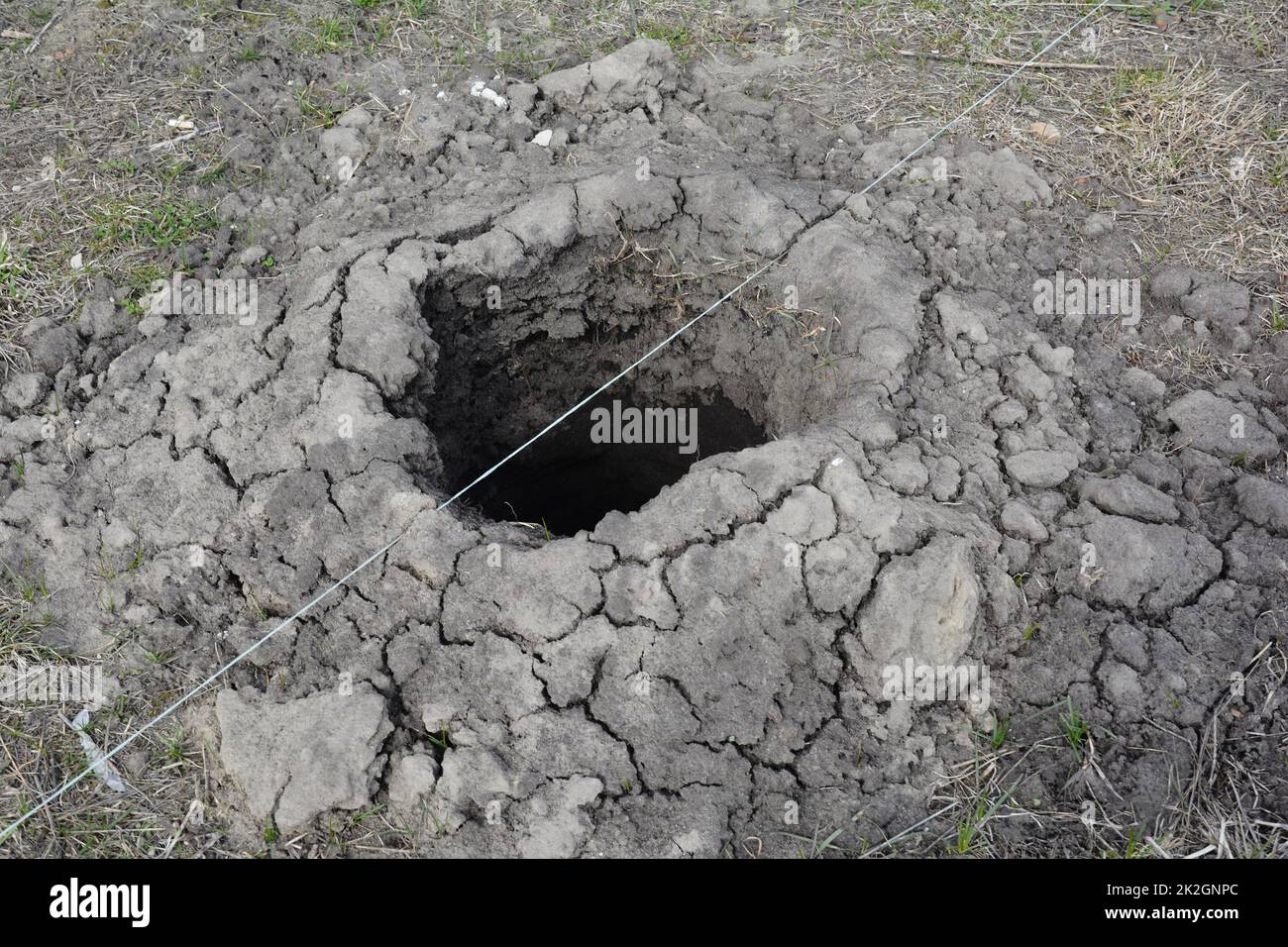 Digging hole for fence  concrete foundation holder. Stock Photo