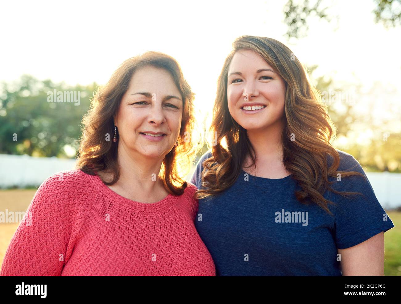 They know that a mothers love never ends. Portrait of a mother and her adult daughter in the backyard at home. Stock Photo