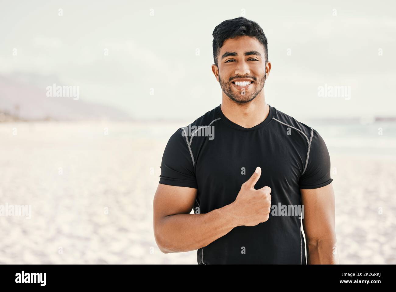 I changed my lifestyle and it changed my life. Shot of a sporty young man showing thumbs up while out for a workout. Stock Photo