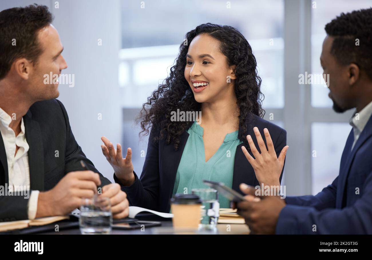Its THAT simple. Cropped shot of a group of white collar workers meeting in the boardroom. Stock Photo
