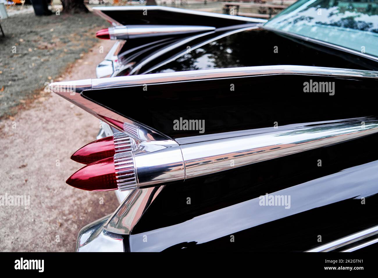 Tail fin of black painted American antique road cruiser Stock Photo