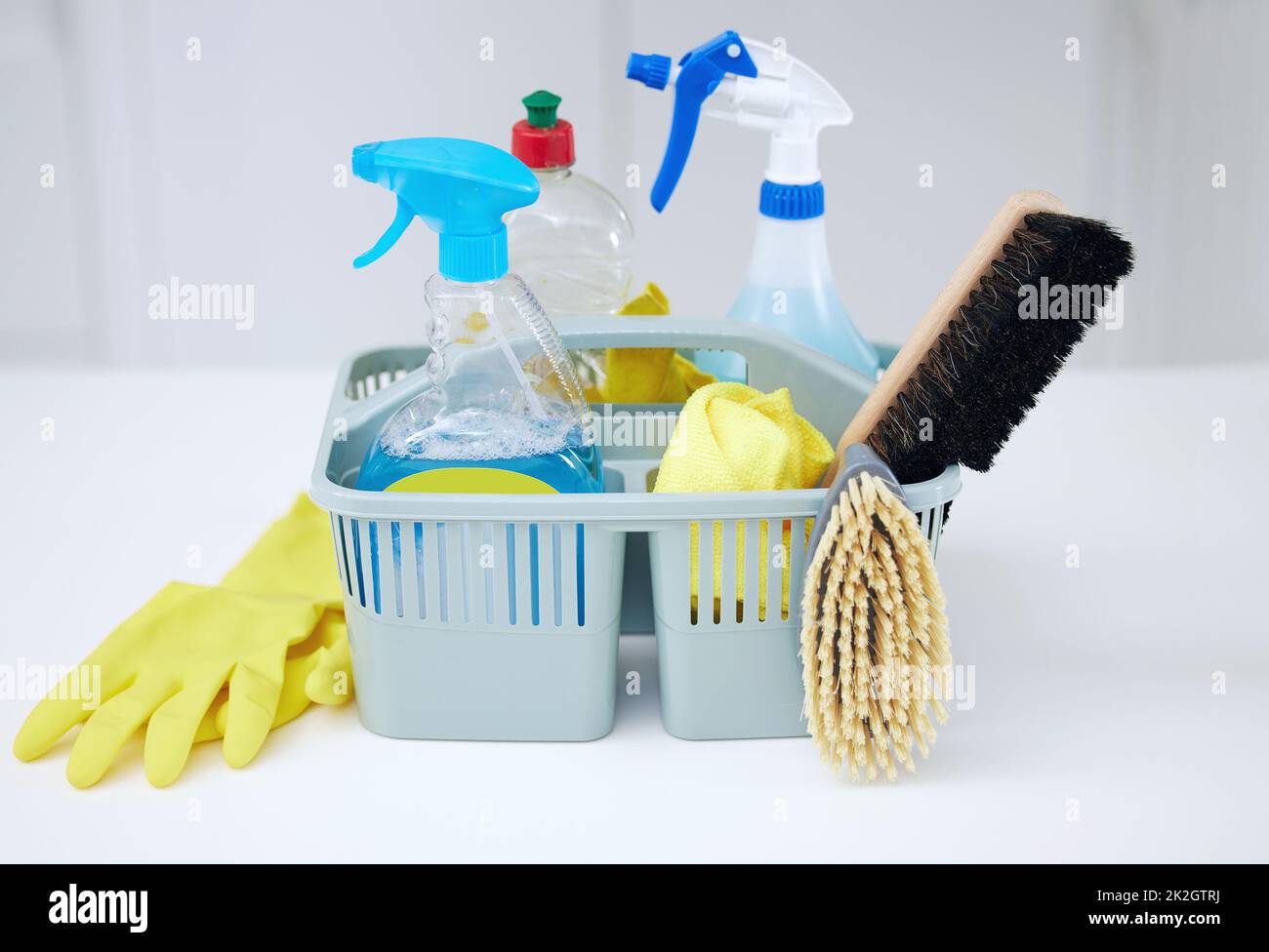 https://c8.alamy.com/comp/2K2GTRJ/ready-for-action-shot-of-cleaning-supplies-in-a-basket-on-a-table-2K2GTRJ.jpg