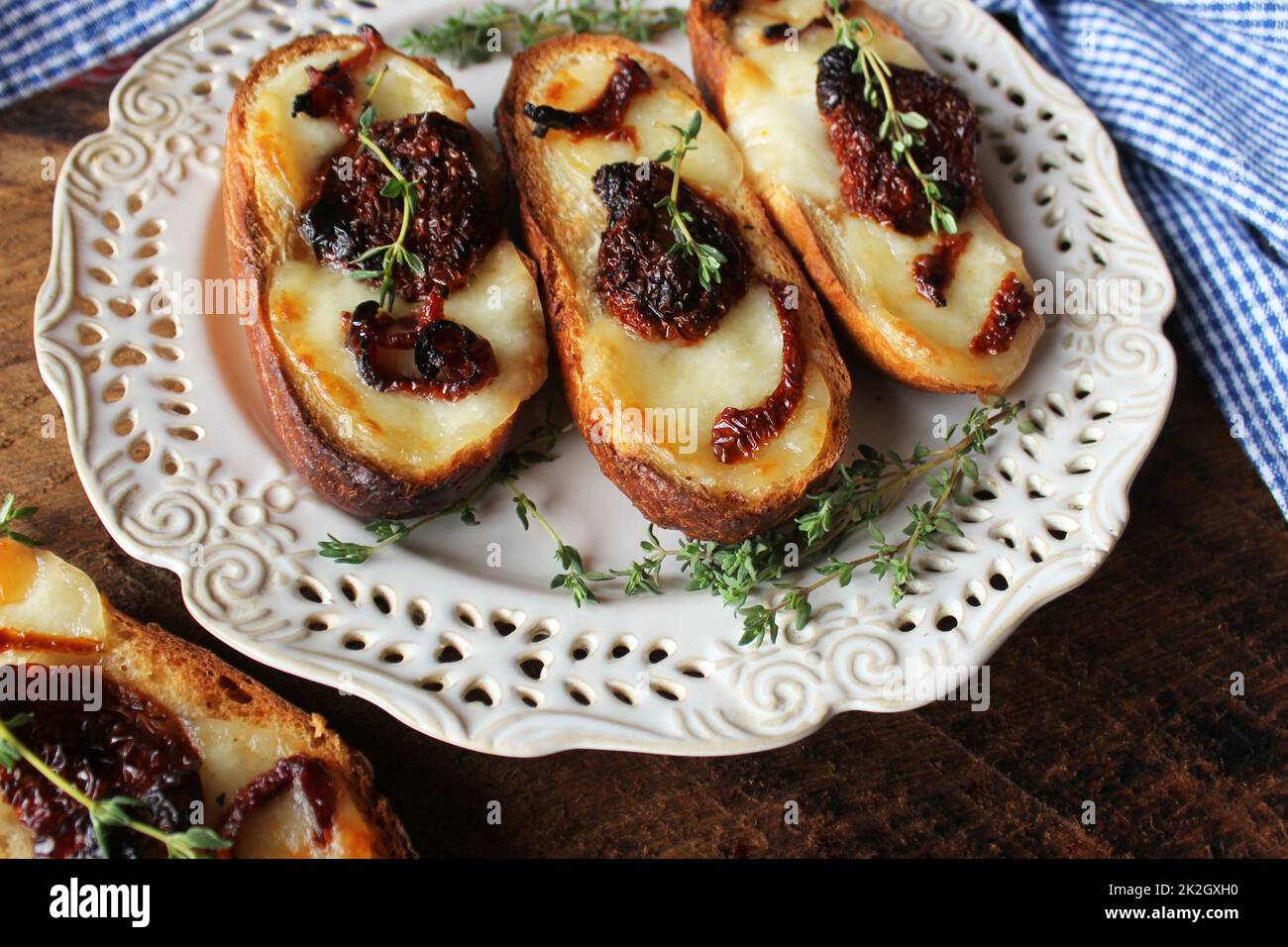 Sandwich with mozzarella sundried tomatoes and thyme Stock Photo Alamy