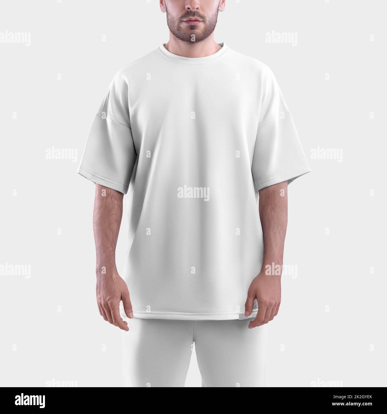 Mockup of a white oversize t-shirt on a man. Clothes template isolated on white background. Stock Photo