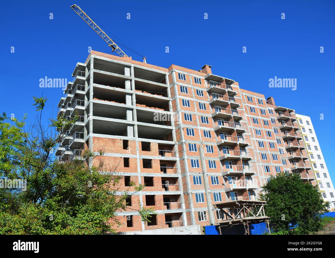 High-rise house construction site with crane tower Stock Photo