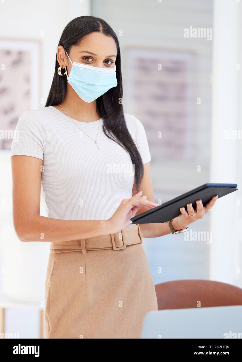 Its important to keep the workplace safe. Shot of a young businesswoman using a digital tablet in her office. Stock Photo