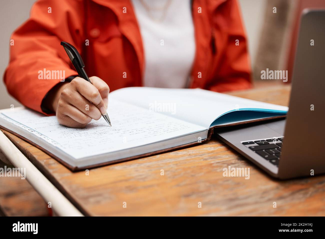 Putting in long hours for my future. Shot of an unrecognizable student studying at college. Stock Photo