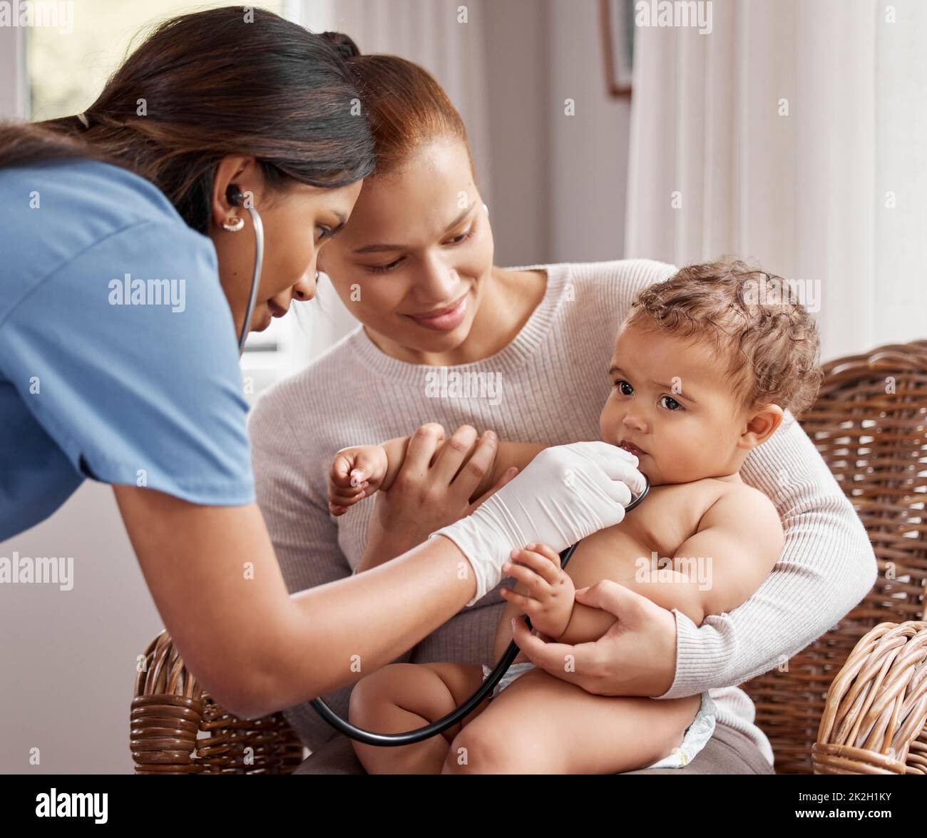 Lets have a listen to those lungs. Shot of a doctor listening to a