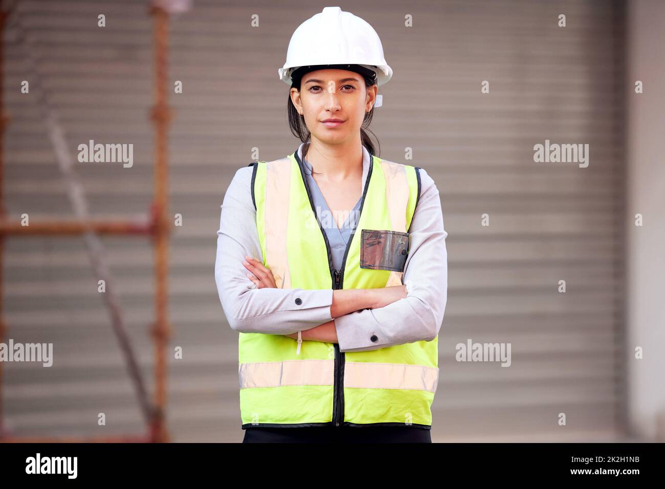 Building this city with my own hands. Shot of a young woman working on a construction site. Stock Photo