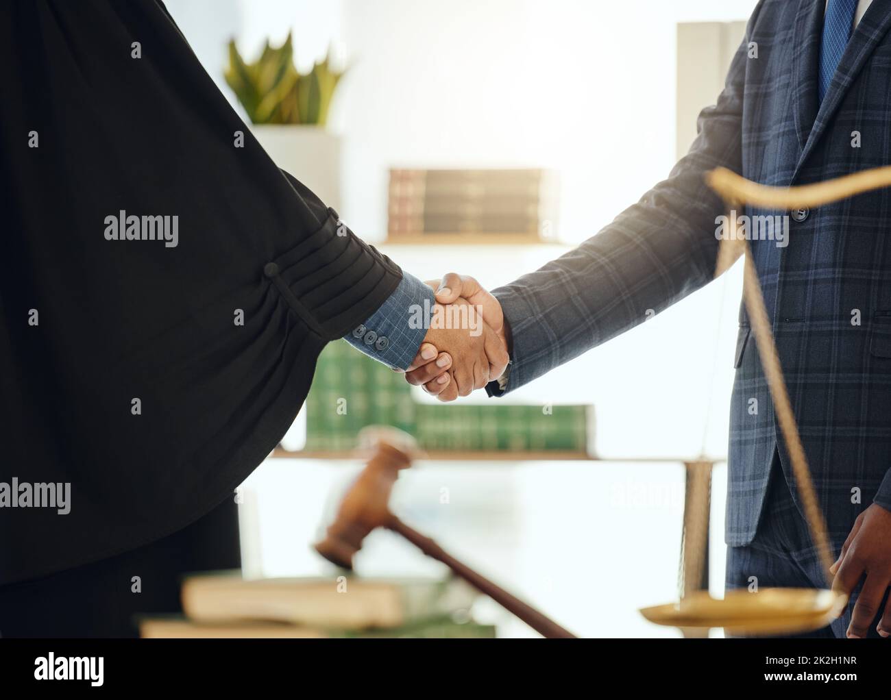 Lets fight injustice together. Shot of two unrecognizable lawyers