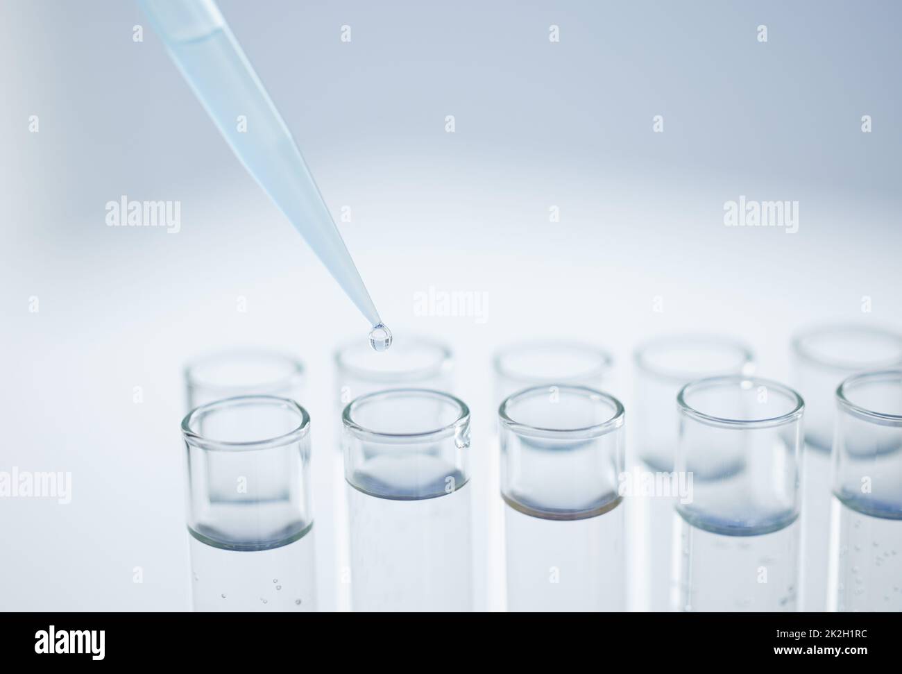 Practising precision in the lab. Closeup shot of a dropper being used