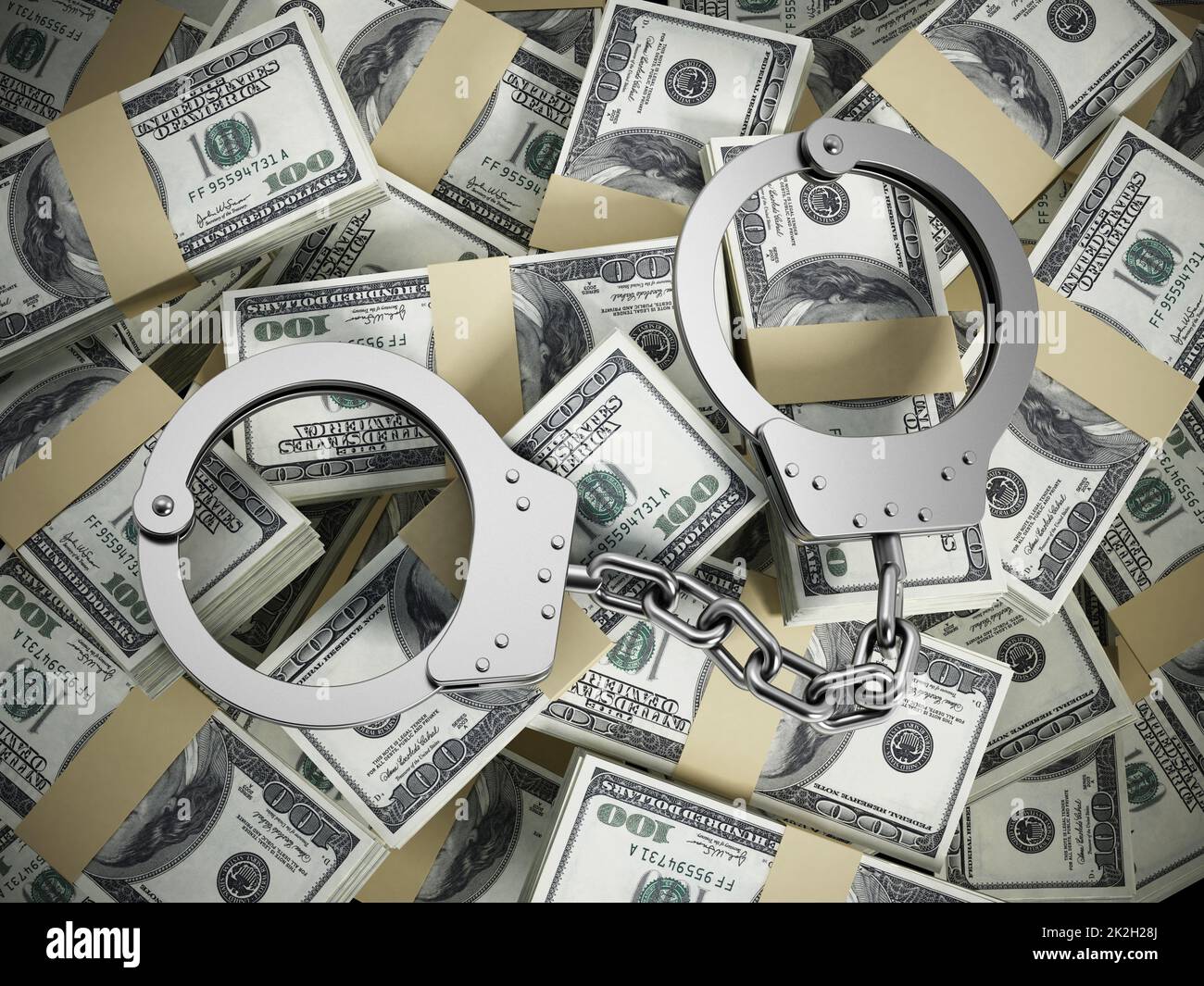 Handcuffs on 100 dollar money pile Stock Photo