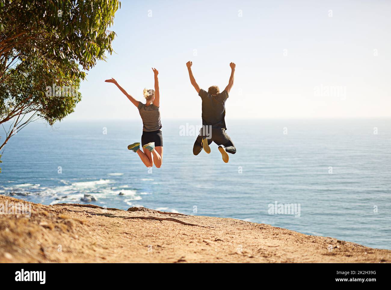 Dont make excuses, make results. Shot of a young couple jumping for joy after their workout. Stock Photo