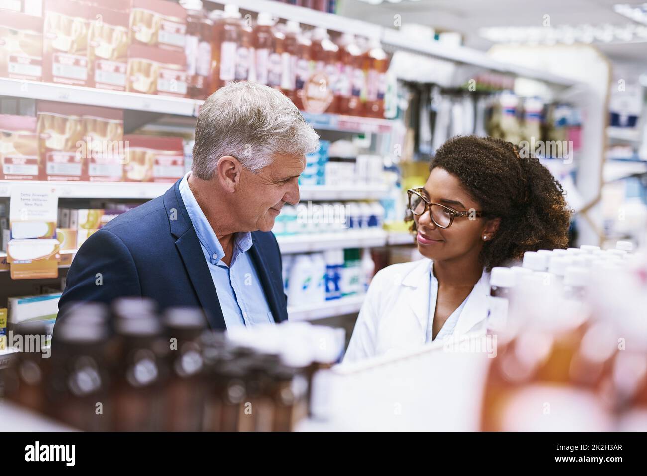 Is that all it takes to help me out. Shot of a helpful young female pharmacist helping a customer with choosing the right medication in the pharmacy. Stock Photo