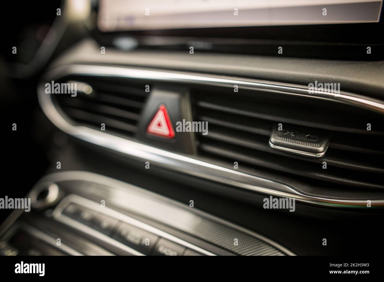 Close up shot of a modern car air vents on the dashboard. Stock Photo